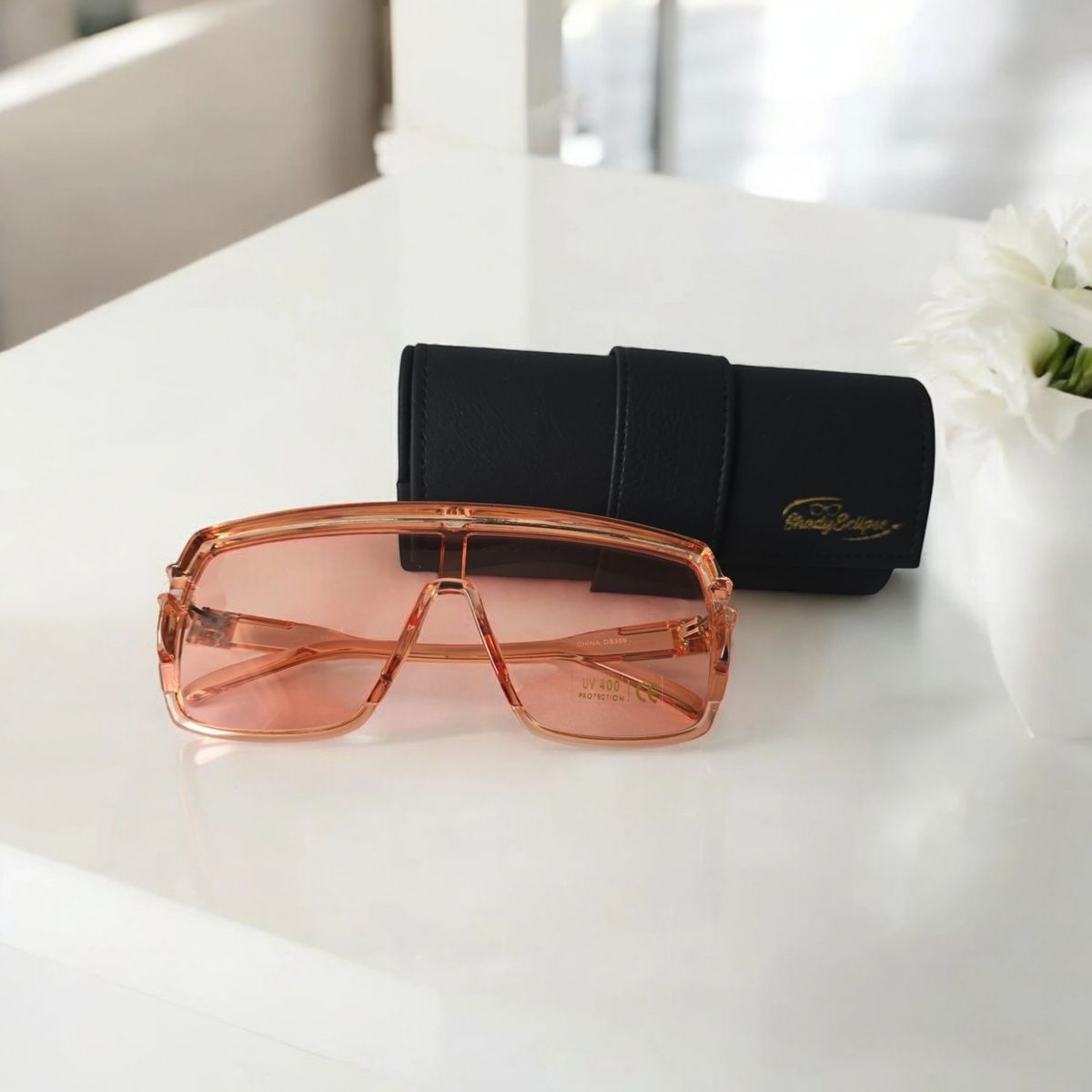Solar Flare Oversized SunglassesThe Solar Flare sunglasses stand out with their bold pink-tinted lenses and matching semi-transparent pink frame. This pair captures the sun's vibrant energy, offeriMy StoreMy StoreSolar Flare Oversized Sunglasses